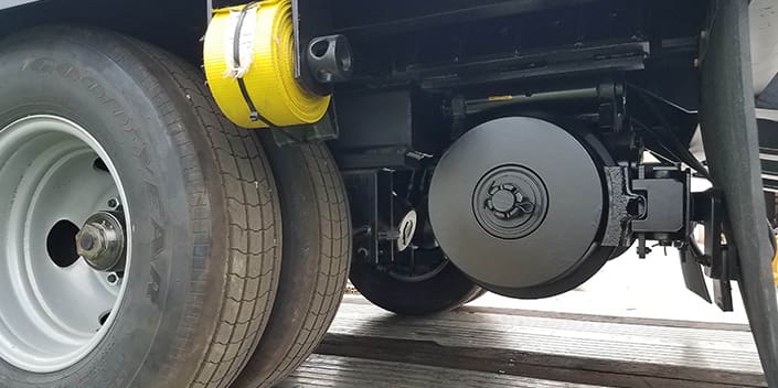 Close up photo of rail gear and brakes on hi rail tag-along trailer built by DymaxRail