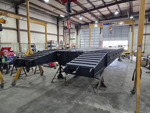 Completed DymaxRail 100-ton Machinery Cart showing its 148-inch width and 50-foot length.
