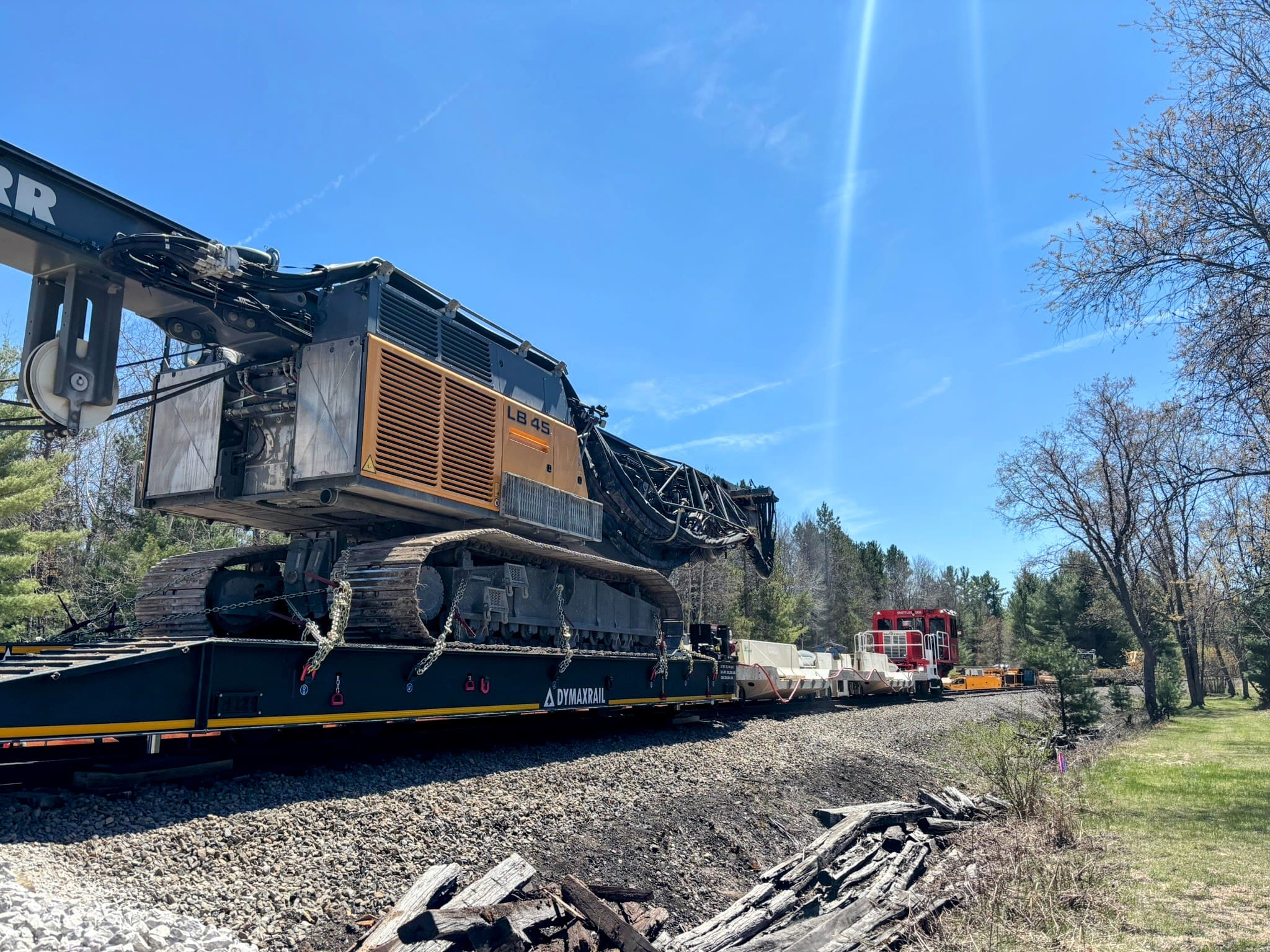 Link-Belt LB45 transported on rail equipment to support the bridge replacement project.