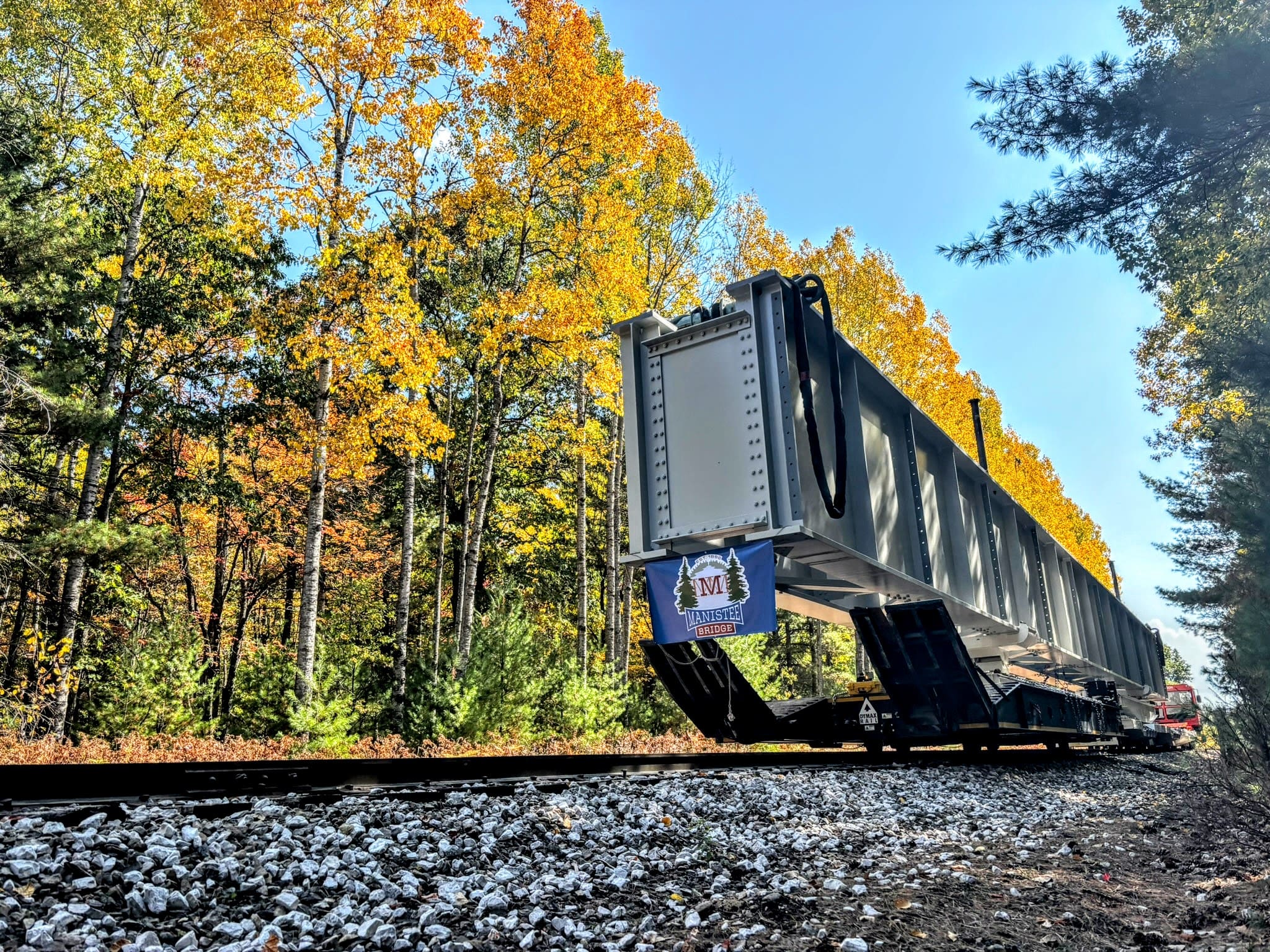 Bridge girder beams moved along the corridor using a rail cart for the bridge rebuild.